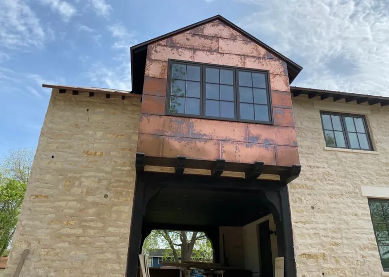 Copper metal panel facade on a stone building for Skylight Installation in Tucson